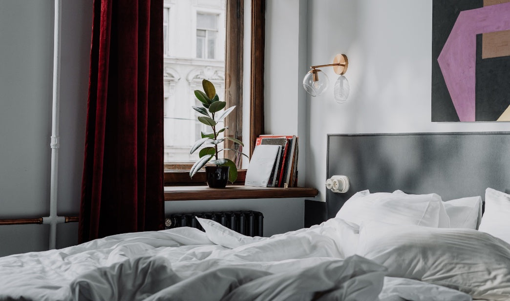 unfolded goose down comforter on a bed