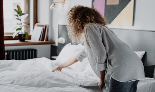 Woman making the bed